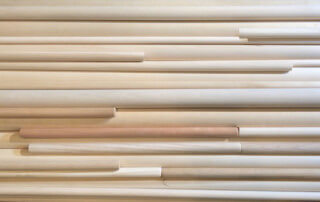 Stack of Various Round Wooden Dowels